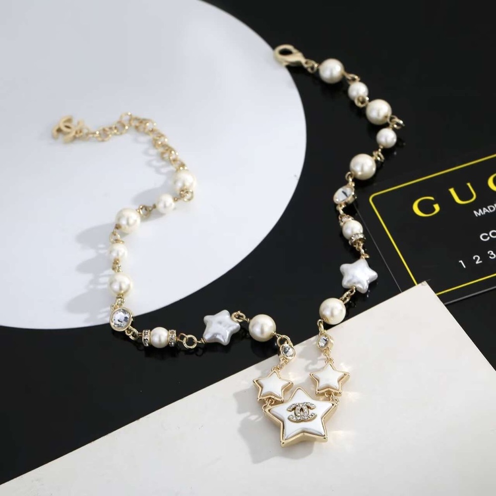 CHANEL Gold and White Star Necklace - Picture 2 of 6